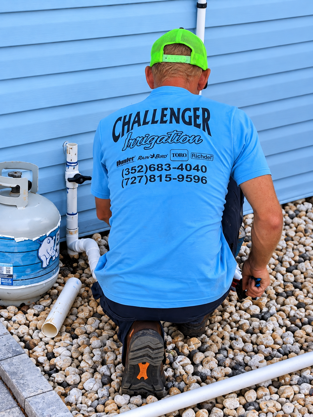 Challenger Irrigation trucks and Kubota equipment staged at the yard